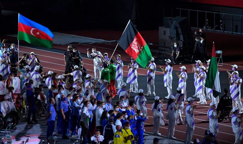 The flag of Team Afghanistan enters the stadium. Getty