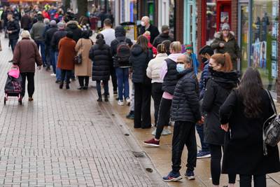 Hundreds of people queue at a vaccination centre on Solihull High Street, West Midlands. PA