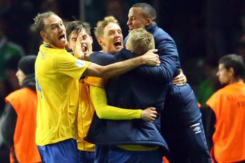 Sweden's Rasmus Elm celebrates his late equaliser against Germany with teammates