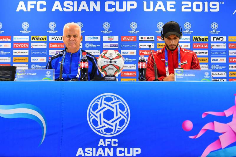 Syria's German coach Bernd Stange, left, and forward Omar Al Soma attend a press conference at Sharjah Stadium in on January 5, 2019, a day ahead of his team's match against Palestine in the 2019 Asian Cup. AFP
