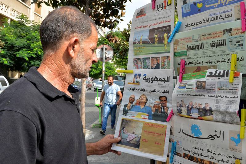 epa06226120 A man checks Al Joumhouria depicting German Chancellor Angela Merkel of the Christian Democratic Union (CDU) on its front page in Beirut, Lebanese, 25 September 2017. According to federal election commissioner more than 61 million people were eligible to vote in the elections for a new federal parliament, the Bundestag, in Germany. The newspaper byline reads 'Merkel for a fourth term!'.  EPA-EFE/WAEL HAMZEH *** Local Caption *** 53790772