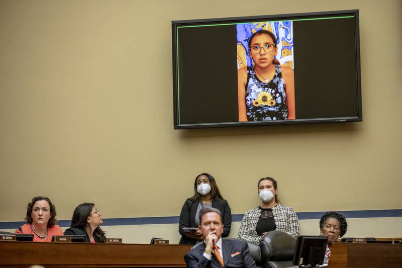 Miah, who survived the mass shooting, appears on a screen during the hearing. The New York Times / AP