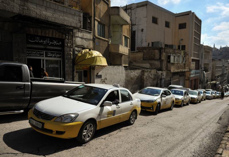 A line of taxis wait for passengers in the Old Town of Amman, Jordan. Getty Images