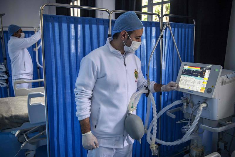 A member of the medical staff at Moroccos's military field hospital in Nouaceur, South of Casablanca, checks a monitor as staff prepared to receive patients of the coronavirus pandemic.  AFP