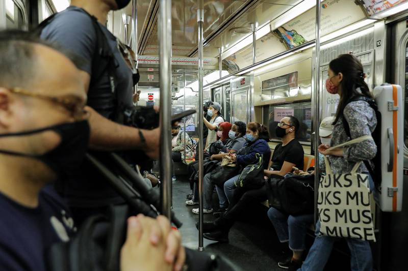People travel on a train in Manhattan, New York. Reuters