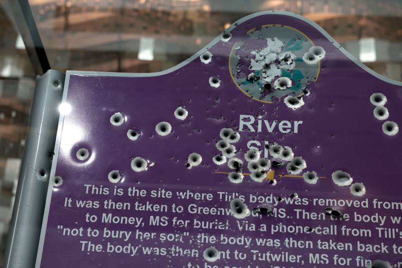 A sign marking where police recovered the body of 14 -year-old Emmett Till is displayed in the entryway of the Smithsonian Museum of American History in Washington. The marker is one of three replaced at the site where police found Till and is a new addition to the permanent collection at the museum. Getty Images / AFP