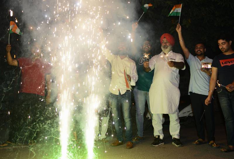 Supporters of the Indian cricket team light fireworks as they celebrate in Amritsar. AFP