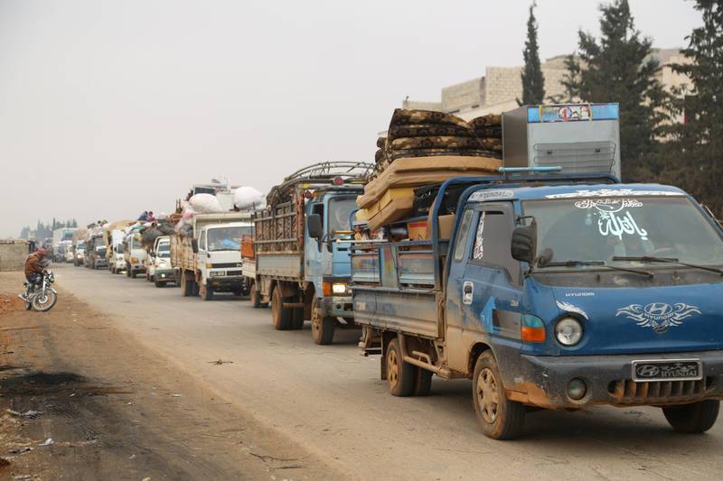Trucks carry belongings of people fleeing from Maarat al-Numan, in northern Idlib, Syria December 24, 2019. REUTERS/Mahmoud Hassano