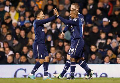 Tottenham Hotspur's Jermain Defoe (R) celebrates his second goal during their English Premier League soccer match against Fulham with teammates Aaron Lennon (L) and Gylfi Sigurdsson at Craven Cottage in London December 1, 2012. REUTERS/Suzanne Plunkett (BRITAIN - Tags: SPORT SOCCER) FOR EDITORIAL USE ONLY. NOT FOR SALE FOR MARKETING OR ADVERTISING CAMPAIGNS. NO USE WITH UNAUTHORIZED AUDIO, VIDEO, DATA, FIXTURE LISTS, CLUB/LEAGUE LOGOS OR "LIVE" SERVICES. ONLINE IN-MATCH USE LIMITED TO 45 IMAGES, NO VIDEO EMULATION. NO USE IN BETTING, GAMES OR SINGLE CLUB/LEAGUE/PLAYER PUBLICATIONS *** Local Caption ***  SLP114_SOCCER-ENGLA_1201_11.JPG