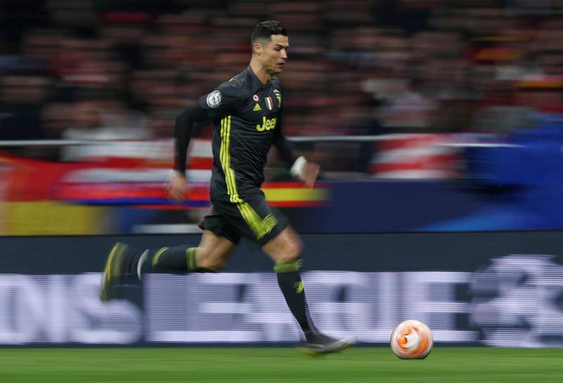 Cristiano Ronaldo runs with the ball against Atletico Madrid. Reuters