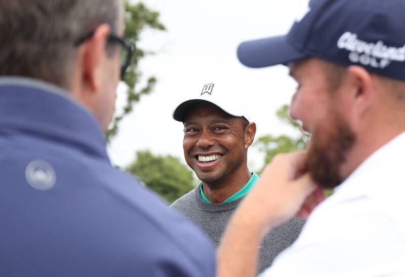 Tiger Woods of United States speaks with Shane Lowry of Ireland at the 8th green. Getty Images