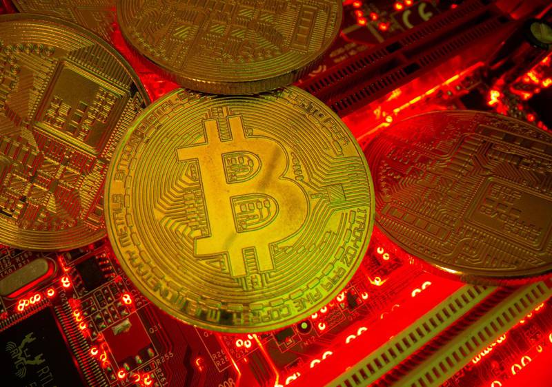 FILE PHOTO: Representations of the virtual currency Bitcoin stand on a motherboard in this picture illustration taken May 20, 2021. REUTERS/Dado Ruvic/Illustration/File Photo