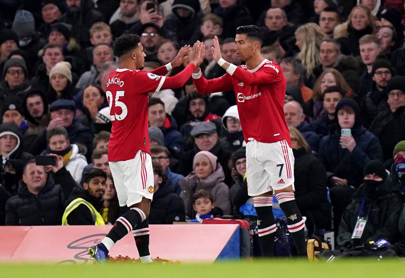 Jadon Sancho is replaced by teammate Cristiano Ronaldo during the Premier League match at Stamford Bridge. AP