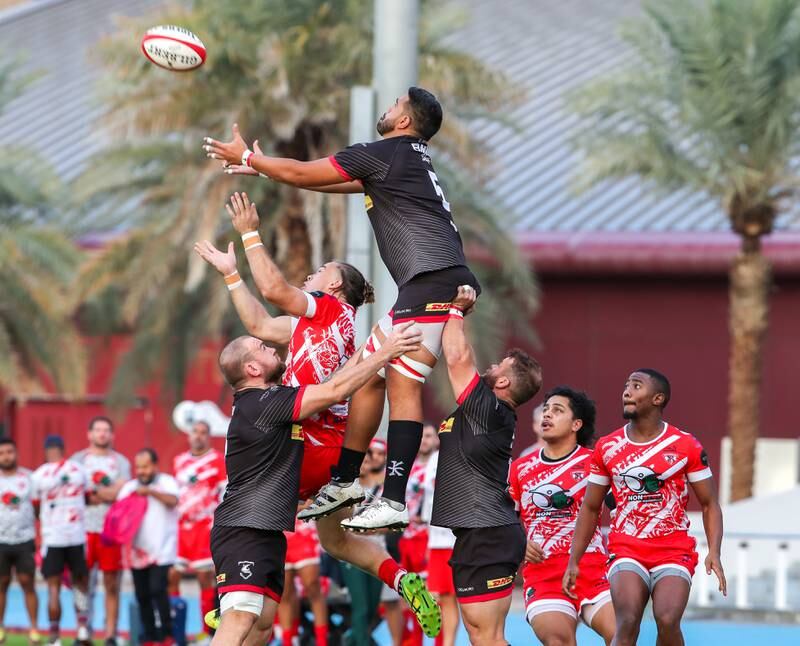 James Kora of Bahrain gets lifted for the ball during the West Asia Premiership game against Dubai Tigers at Dubai Sports City, Dubai, on January 7, 2023. All photos Victor Besa / The National