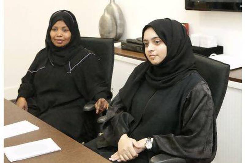 Fatma Hassan Essa (left), media and community awareness manager, and Roudha Abdulla Albahri, activities co-ordinator, at the Dubai Foundation for Women and Children. Jaime Puebla / The National