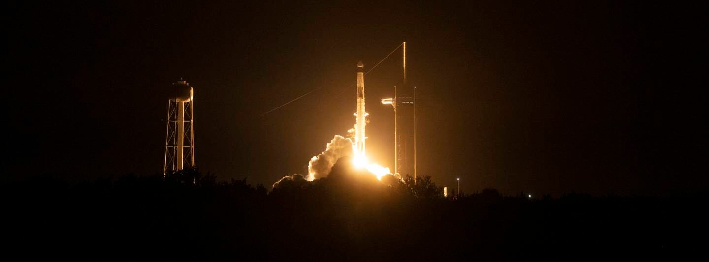 The SpaceX Falcon 9 rocket carrying the Crew Dragon spacecraft lifts off. EPA