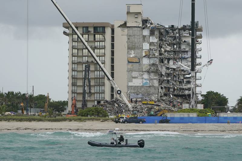  A law enforcement boat patrols the ocean near the collapsed building. AP
