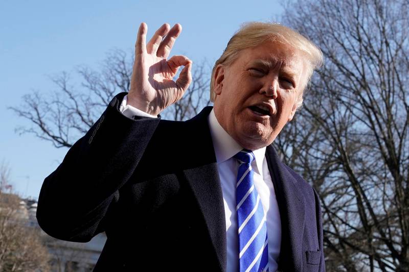 U.S. President Donald Trump gestures as he talks to the media on South Lawn of the White House in Washington, U.S., before his departure to Camp David, December 16, 2017. REUTERS/Yuri Gripas     TPX IMAGES OF THE DAY