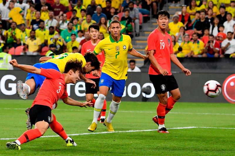 Brazil'sLucas Paqueta heads home the first goal. AFP