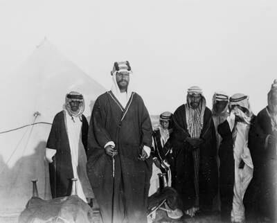 Abd al-Aziz Ibn Saud standing- with son and followers- near Thaj.

W.H.I. Shakespear / Royal Geographical Society *** Local Caption ***  S0010639.jpg