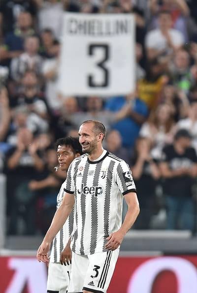 A Juventus supporter holds up a sign for Juve defender Giorgio Chiellini. EPA