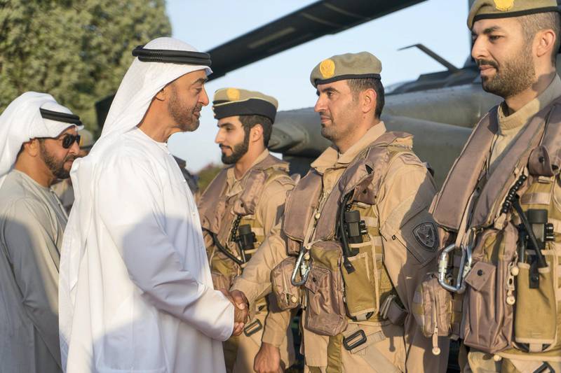 ABU DHABI, UNITED ARAB EMIRATES - January 21, 2019: HH Sheikh Mohamed bin Zayed Al Nahyan, Crown Prince of Abu Dhabi and Deputy Supreme Commander of the UAE Armed Forces (2nd L), greets members of the UAE Armed forces and developers who worked on the new weapon system developed by the UAE for Black Hawk helicopters. Seen with HH Sheikh Hamdan bin Zayed Al Nahyan, Ruler���s Representative in Al Dhafra Region (L).
( Rashed Al Mansoori / Ministry of Presidential Affairs )
---