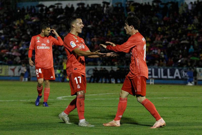 Real Madrid's Alvaro Odriozola, right, celebrates with his teammate Lucas Vazquez after scoring during the Spanish Copa del Rey match between Melilla and Real Madrid. AP Photo