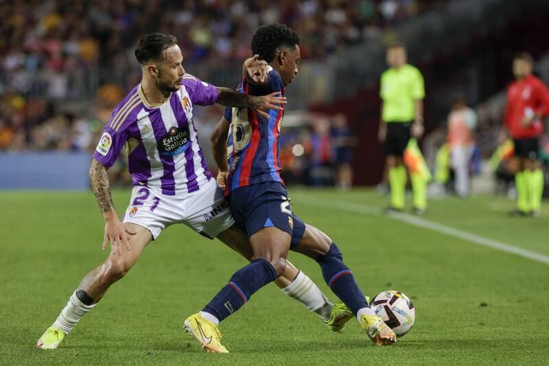 Barcelona defender Alejandro Balde takes on Real Valladolid midfielder Ivan Sanchez. EPA