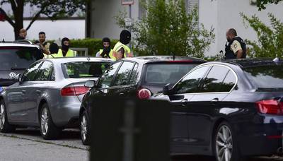 Police search for gunmen in a residential area near the Olympia shopping centre where several people were shot dead on July 22, 2016. Marc Kleine-Kleffmann / AP Photo
