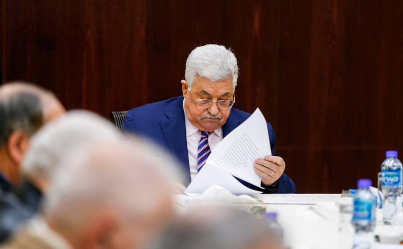 Palestinian president Mahmoud Abbas reads notes as he chairs a meeting of the Palestine Liberation Organization (PLO) Executive Committee at the Palestinian Authority headquarters in the West Bank city of Ramallah on February 3, 2018, discussing recommendations to suspend the PLO's recognition of Israel in response to US President Donald Trump's declaration of Jerusalem as Israel's capital. / AFP PHOTO / ABBAS MOMANI
