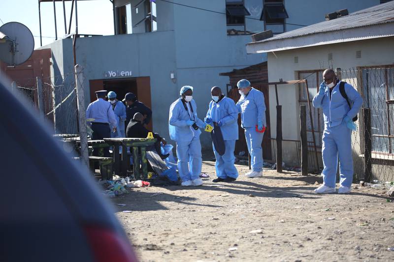 Forensic personnel begin their investigation into the deaths of 20 people found inside the Enyobeni Tavern, Scenery Park, outside East London, South Africa. All photos: Reuters
