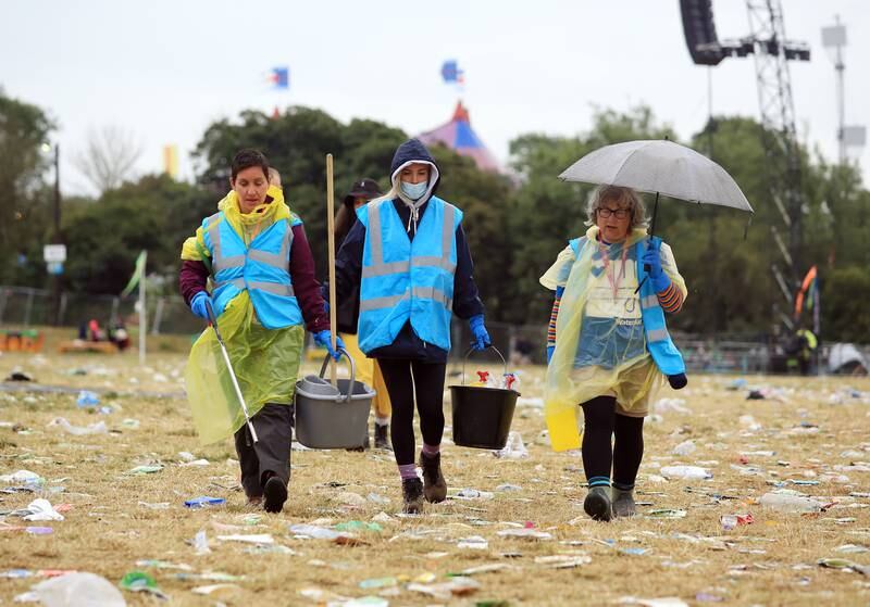 It's a major operation to de-litter the Somerset dairy farm after 200,000 people attended the festival. EPA