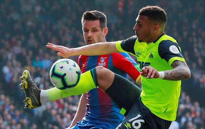 Huddersfield Town's Karlan Ahearne-Grant in action with Crystal Palace's Scott Dann. Action Images via Reuters