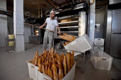 A man makes bread in a bakery in Tunis. AFP