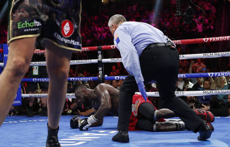 Deontay Wilder is knocked down by Tyson Fury in the third round. Reuters