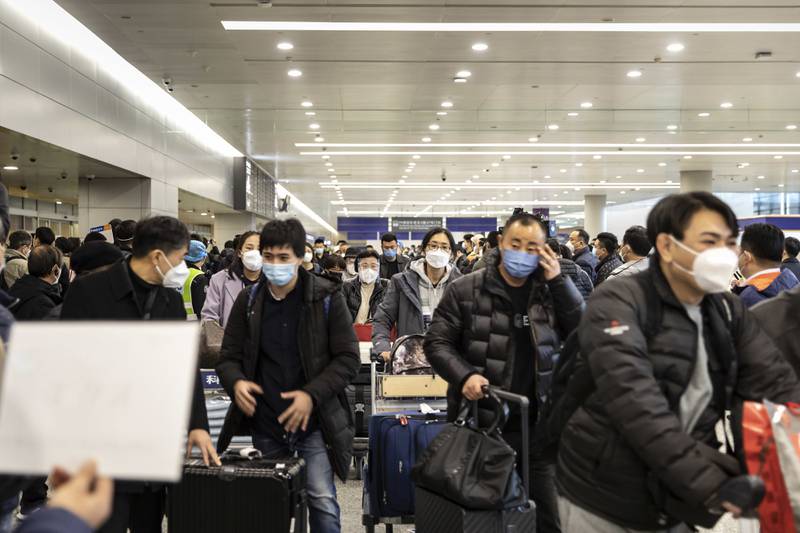Passengers at Pudong International Airport in Shanghai. The reopening of China’s borders marks the end of zero-Covid, a strategy that left the country's economy isolated for three years and weighed heavily on economic growth. Bloomberg