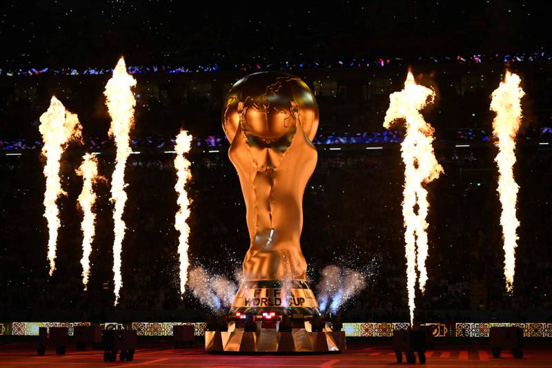 Fireworks explode around a replica of the FIFA World Cup trophy during the opening ceremony. AFP