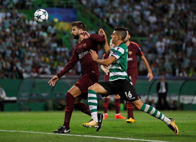 Sporting’s Rodrigo Battaglia challenges Barcelona’s Gerard Pique. Rafael Marchante / Reuters