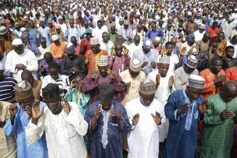 Muslims perform Eid Al Fitr prayers in an outdoor area in Lagos, Nigeria. AP