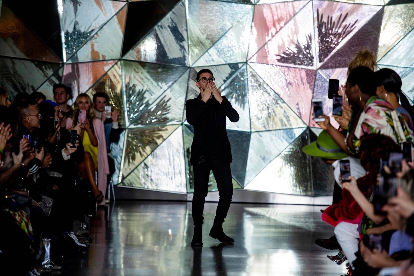 American fashion designer Christian Siriano acknowledges applause at the conclusion of his presentation during New York Fashion Week on February 9, 2019 in New York City.  / AFP / Johannes EISELE

