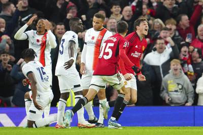 Manchester United's Victor Lindelof, right, celebrates after scoring his side's opening goal against Luton Town. AP