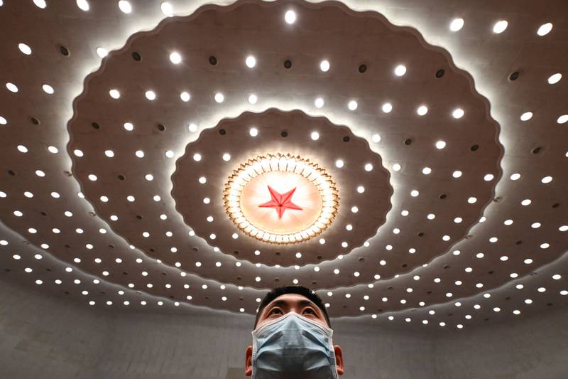 A security officer after the second plenary session of the National People's Congress at the Great Hall of the People in Beijing, China. AFP