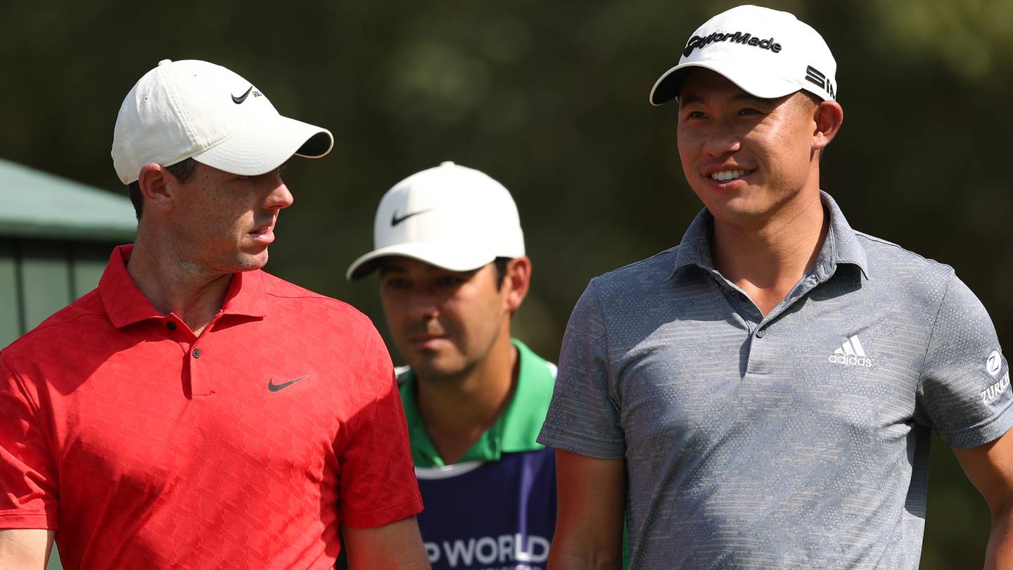 Rory McIlroy and Collin Morikawa during the third round of the DP World Tour Championship. EPA