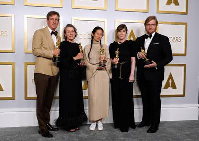 Best Picture: 'Nomadland' cast and producers, from left: Peter Spears, Frances McDormand, Chloe Zhao, Mollye Asher and Dan Janvey, pose in the press room at the Oscars on Sunday, April 25, 2021, at Union Station in Los Angeles. AP Photo