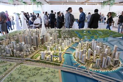 Above, visitors view a scaled version of the Dubai Creek development. Pawan Singh / The National