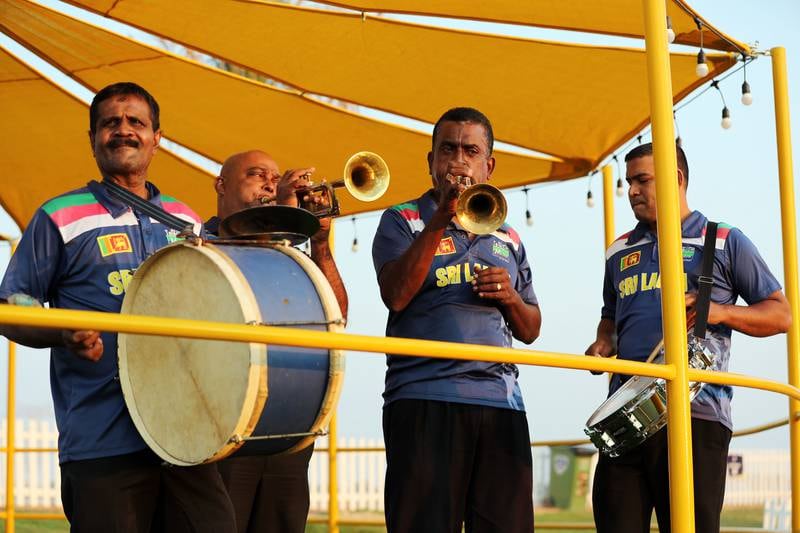 The musicians, who play the trumpet, trombone and drums, add to the atmosphere at matches.