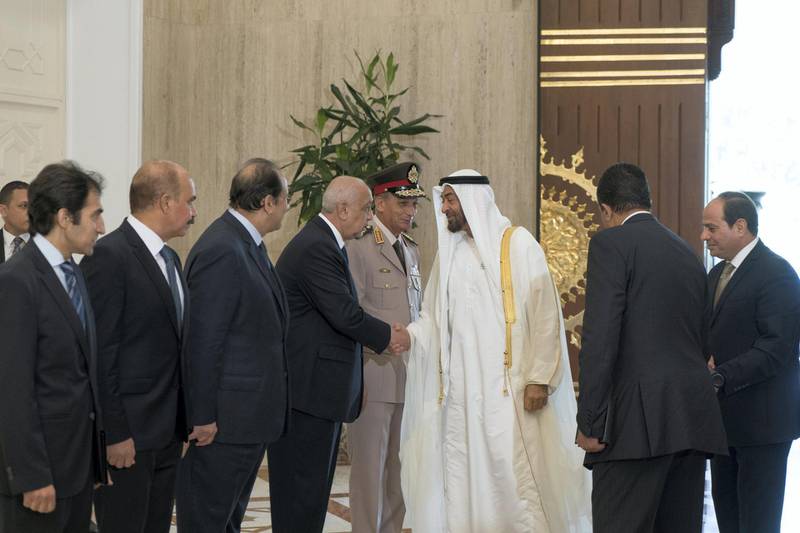 CAIRO, EGYPT - August 07, 2018: HH Sheikh Mohamed bin Zayed Al Nahyan Crown Prince of Abu Dhabi Deputy Supreme Commander of the UAE Armed Forces (3rd R), greets a guest, at the Heliopolis Palace. Seen with HE Abdel Fattah El-Sisi President of Egypt (R).
( Rashed Al Mansoori / Crown Prince Court - Abu Dhabi )
---