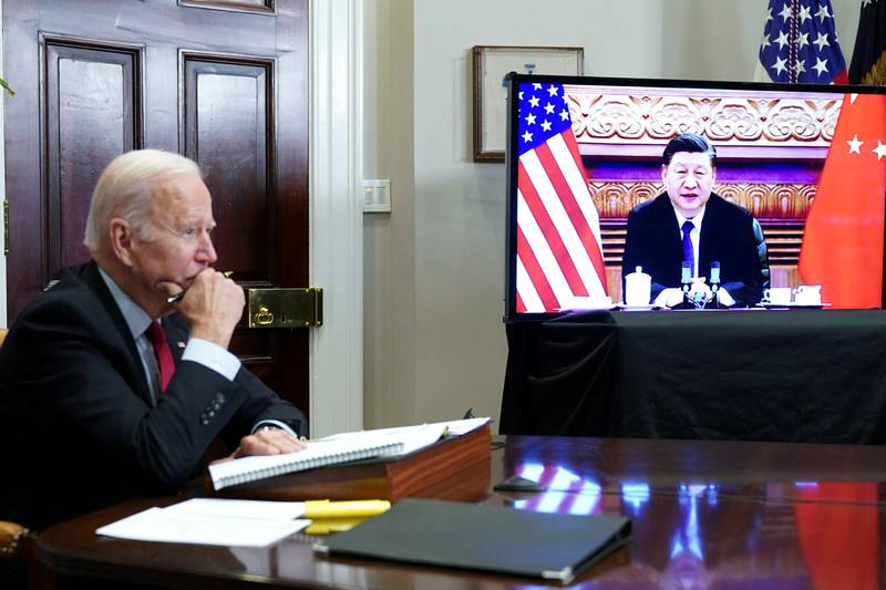 US President Joe Biden meets China's President Xi Jinping during a virtual summit this month. AFP