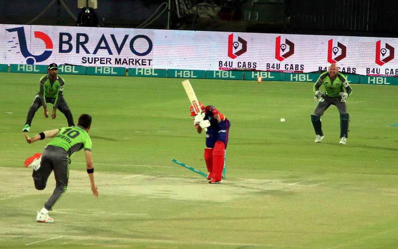 Lahore Qalandars quick Shaheen Afridi clean bowls Karachi Kings' Babar Azam in the Spakistan Super League match at the National Stadium on Sunday, February 28. EPA