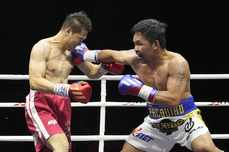Manny Pacquiao lands a punch on DK Yoo during the second round of their exhibition bout. AP